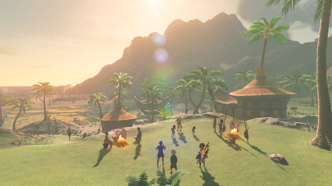 Screenshot of the game, showing a tropical village with palm trees and huts. A lot of people are partying around bonfires